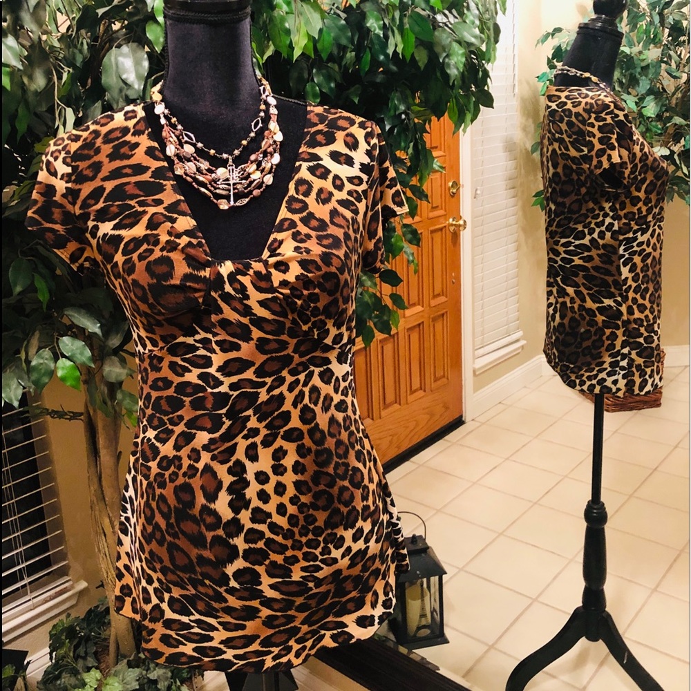 Cheetah print polyester stretch top. Dressy/casual